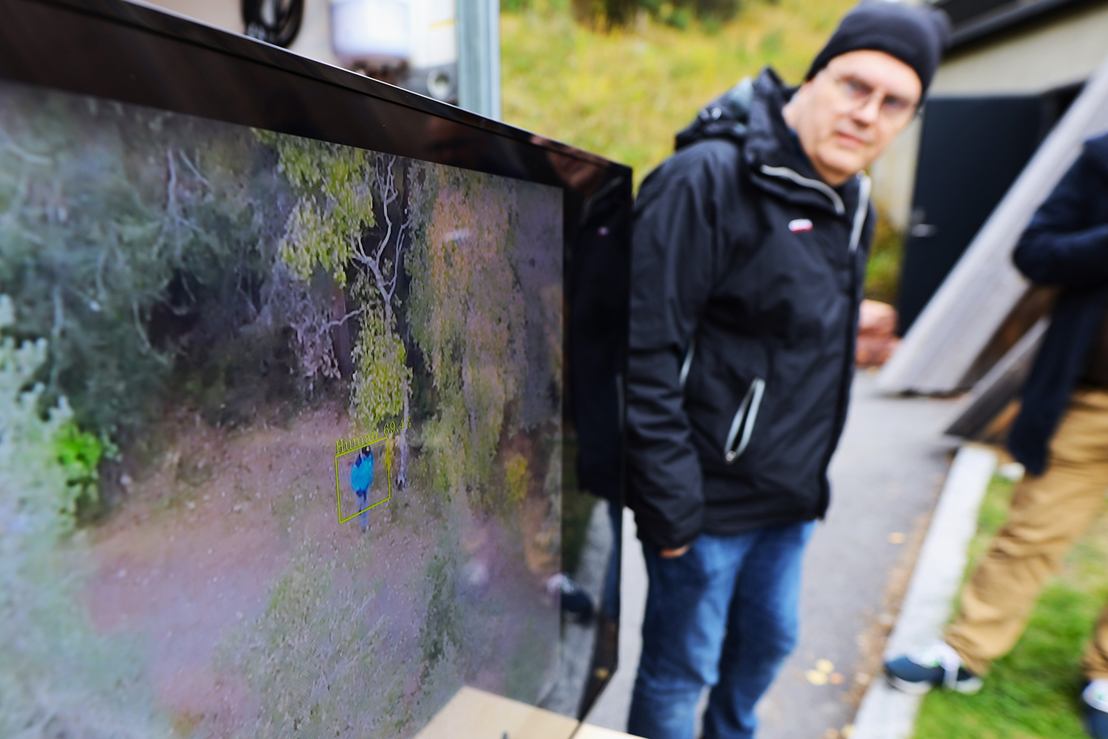 Man looking at screen transmitted from drone